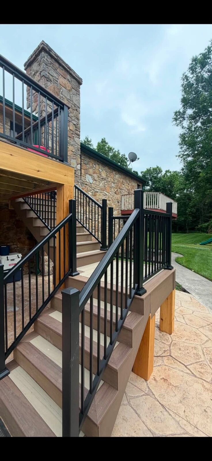 Gray composite decking on a covered porch